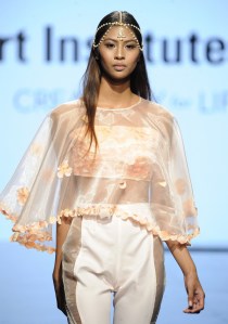 LOS ANGELES, CA - OCTOBER 12: A model walks the runway wearing Melynda Valera at Art Hearts Fashion Los Angeles Fashion The Art Institutes Showcase on October 12, 2016 in Los Angeles, California. (Photo by Arun Nevader/Getty Images for Art Hearts Fashion)