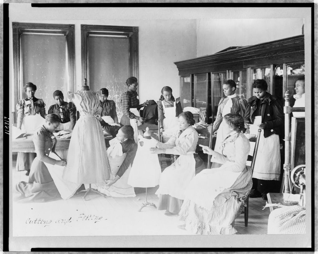 Young women cutting and fitting clothing in class at Agricultural and Mechanical College, Greensboro, N.C.